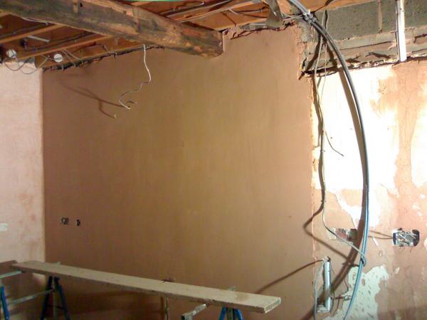 celing lifted, beams put in walls plastered