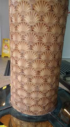 Column with embossed Victorian tiling follow restoration.